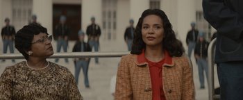 Movie still from “Selma” (2014), directed by Ava DuVernay – A woman standing in front of a group of people; Medium shot, Over the shoulder angle