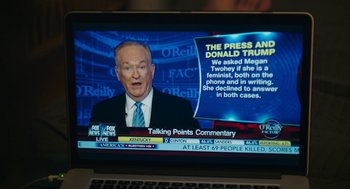 Movie still from “She Said” (2022), directed by Maria Schrader – A television screen showing a news program with an image of bill o 're illy on it; Close Up shot, Over the shoulder angle