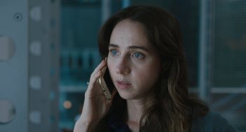 Movie still from “She Said” (2022), directed by Maria Schrader – A person talking on a cell phone; Close Up shot, High angle