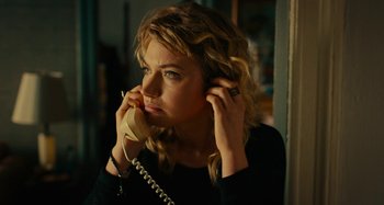 Movie still from “She's Funny That Way” (2014), directed by Peter Bogdanovich – A woman holding a phone up to her ear; Close Up shot, High angle