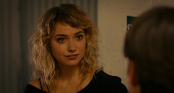 Movie still from “She's Funny That Way” (2014), directed by Peter Bogdanovich – A beautiful young lady looking into a mirror; Close Up shot, Over the shoulder angle