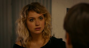 Movie still from “She's Funny That Way” (2014), directed by Peter Bogdanovich – A beautiful young lady looking into a mirror; Close Up shot, Over the shoulder angle