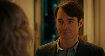 Movie still from “She's Funny That Way” (2014), directed by Peter Bogdanovich – A person wearing a suit and tie; Close Up shot, Over the shoulder angle