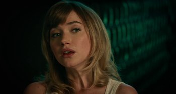 Movie still from “She's Funny That Way” (2014), directed by Peter Bogdanovich – A person with long blonde hair; Close Up shot, Over the shoulder angle