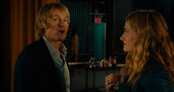 Movie still from “She's Funny That Way” (2014), directed by Peter Bogdanovich – A man and a woman are talking in a room; Medium shot, Over the shoulder angle