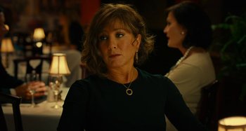 Movie still from “She's Funny That Way” (2014), directed by Peter Bogdanovich – A person wearing a black shirt; Close Up shot, Over the shoulder angle