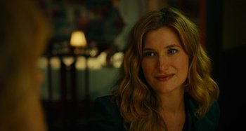 Movie still from “She's Funny That Way” (2014), directed by Peter Bogdanovich – A person with long blonde hair; Close Up shot, Over the shoulder angle
