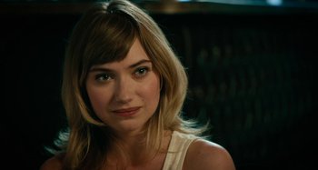 Movie still from “She's Funny That Way” (2014), directed by Peter Bogdanovich – A person wearing a white shirt; Close Up shot, Over the shoulder angle