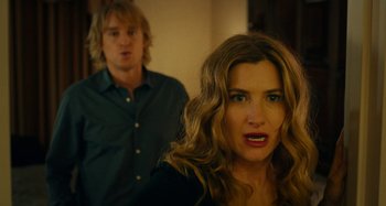 Movie still from “She's Funny That Way” (2014), directed by Peter Bogdanovich – A man and a woman are standing in a room; Close Up shot, Over the shoulder angle
