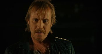 Movie still from “She's Funny That Way” (2014), directed by Peter Bogdanovich – A person wearing a leather jacket; Close Up shot, Low angle
