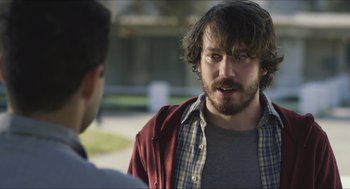 Movie still from “Short Term 12” (2013), directed by Destin Daniel Cretton – A man in a plaid shirt talking to another man in a red jacket; Close Up shot, Over the shoulder angle