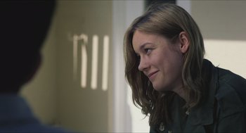 Movie still from “Short Term 12” (2013), directed by Destin Daniel Cretton – A person with long brown hair; Close Up shot, Over the shoulder angle