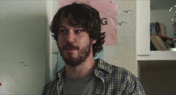 Movie still from “Short Term 12” (2013), directed by Destin Daniel Cretton – A person wearing a plaid shirt; Close Up shot, Over the shoulder angle
