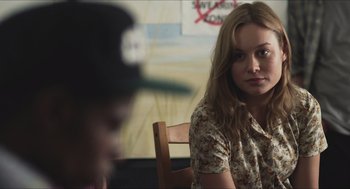 Movie still from “Short Term 12” (2013), directed by Destin Daniel Cretton – A woman sitting at a wooden table in front of a man; Close Up shot, Over the shoulder angle