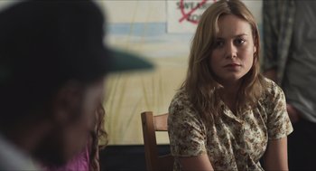 Movie still from “Short Term 12” (2013), directed by Destin Daniel Cretton – A woman sitting at a table with another woman; Close Up shot, Over the shoulder angle