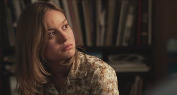 Movie still from “Short Term 12” (2013), directed by Destin Daniel Cretton – A woman in a floral shirt looking to her left; Close Up shot, Over the shoulder angle