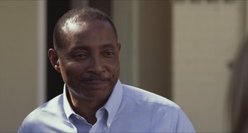 Movie still from “Short Term 12” (2013), directed by Destin Daniel Cretton – A person wearing a white shirt; Close Up shot, Over the shoulder angle