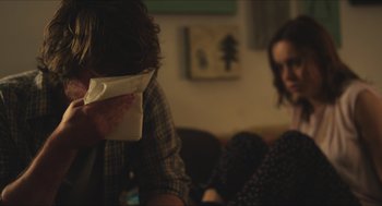 Movie still from “Short Term 12” (2013), directed by Destin Daniel Cretton – Two people sitting in a living room , one of which is holding a tissue; Close Up shot, Over the shoulder angle