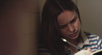 Movie still from “Short Term 12” (2013), directed by Destin Daniel Cretton – A woman is looking down at her cell phone; Close Up shot, Over the shoulder angle