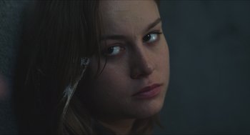 Movie still from “Short Term 12” (2013), directed by Destin Daniel Cretton – A woman's face with a feather in her hair; Close Up shot, Over the shoulder angle