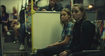 Movie still from “Short Term 12” (2013), directed by Destin Daniel Cretton – Two women are sitting on a public transit bus; Medium shot, Over the shoulder angle