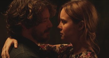 Movie still from “Short Term 12” (2013), directed by Destin Daniel Cretton – A man and a woman face to face in a dark room; Close Up shot, Over the shoulder angle