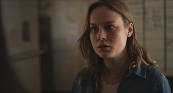 Movie still from “Short Term 12” (2013), directed by Destin Daniel Cretton – A woman with long brown hair is looking at the camera; Close Up shot, Over the shoulder angle