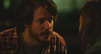 Movie still from “Short Term 12” (2013), directed by Destin Daniel Cretton – A person wearing a plaid shirt; Close Up shot, Over the shoulder angle