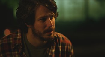 Movie still from “Short Term 12” (2013), directed by Destin Daniel Cretton – A person wearing a plaid shirt; Close Up shot, Over the shoulder angle