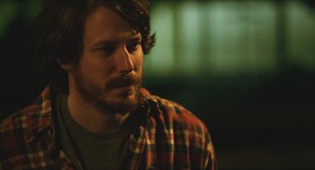 Movie still from “Short Term 12” (2013), directed by Destin Daniel Cretton – A person wearing a plaid shirt; Close Up shot, Over the shoulder angle