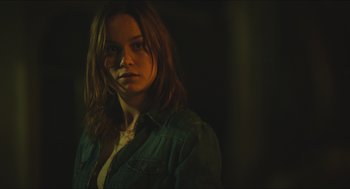 Movie still from “Short Term 12” (2013), directed by Destin Daniel Cretton – A woman with long brown hair wearing a jean jacket; Close Up shot, Over the shoulder angle