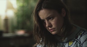Movie still from “Short Term 12” (2013), directed by Destin Daniel Cretton – A person with long brown hair; Close Up shot, Over the shoulder angle