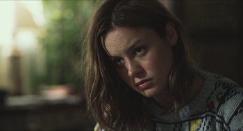 Movie still from “Short Term 12” (2013), directed by Destin Daniel Cretton – A person with long brown hair; Close Up shot, Over the shoulder angle