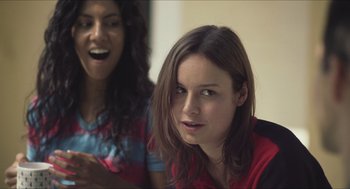 Movie still from “Short Term 12” (2013), directed by Destin Daniel Cretton – Two young women sitting next to each other in a room; Close Up shot, Over the shoulder angle