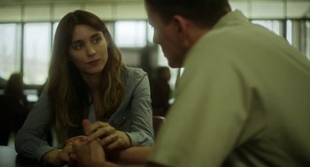 Movie still from “Side Effects” (2013), directed by Steven Soderbergh – A man and a woman sitting at a table talking to each other; Close Up shot, Over the shoulder angle