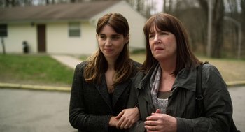 Movie still from “Side Effects” (2013), directed by Steven Soderbergh – A woman and a girl standing next to each other; Close Up shot, Over the shoulder angle