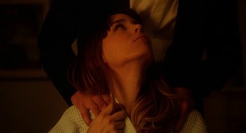 Movie still from “Side Effects” (2013), directed by Steven Soderbergh – A beautiful woman laying on top of a bed; Close Up shot, Low angle