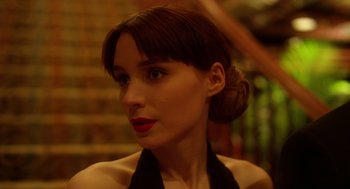 Movie still from “Side Effects” (2013), directed by Steven Soderbergh – A person wearing a dress; Close Up shot, Over the shoulder angle