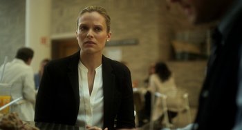 Movie still from “Side Effects” (2013), directed by Steven Soderbergh – A woman wearing a black jacket and a white shirt; Close Up shot, Over the shoulder angle