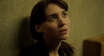 Movie still from “Side Effects” (2013), directed by Steven Soderbergh – A person looking to her left; Close Up shot, Low angle