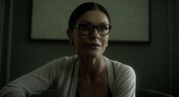 Movie still from “Side Effects” (2013), directed by Steven Soderbergh – A person wearing glasses; Close Up shot, Low angle