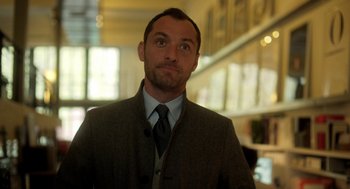 Movie still from “Side Effects” (2013), directed by Steven Soderbergh – A person wearing a suit and tie; Close Up shot, Low angle