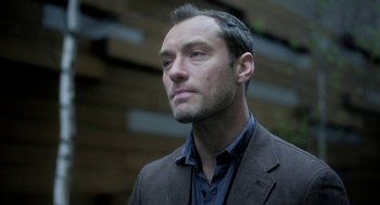 Movie still from “Side Effects” (2013), directed by Steven Soderbergh – A person wearing a suit and tie; Close Up shot, Low angle