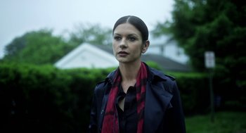 Movie still from “Side Effects” (2013), directed by Steven Soderbergh – A woman wearing a black jacket and a red scarf; Close Up shot, Low angle