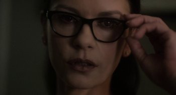 Movie still from “Side Effects” (2013), directed by Steven Soderbergh – A person wearing a pair of eyeglasses; Close Up shot, Over the shoulder angle