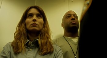 Movie still from “Side Effects” (2013), directed by Steven Soderbergh – A man and a woman standing next to each other; Close Up shot, Low angle