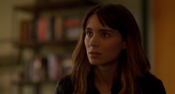 Movie still from “Side Effects” (2013), directed by Steven Soderbergh – A person with long brown hair; Close Up shot, Over the shoulder angle