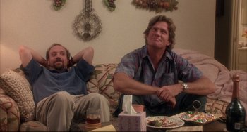 Movie still from “Sideways” (2004), directed by Alexander Payne – Two men sitting on a couch watching television; Medium shot, Low angle