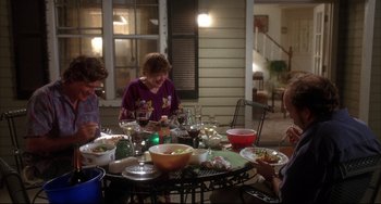 Movie still from “Sideways” (2004), directed by Alexander Payne – A group of people sitting around a table with food; Wide shot, High angle