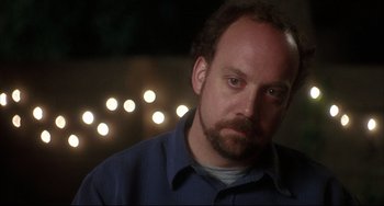 Movie still from “Sideways” (2004), directed by Alexander Payne – A person wearing a blue shirt; Close Up shot, Over the shoulder angle